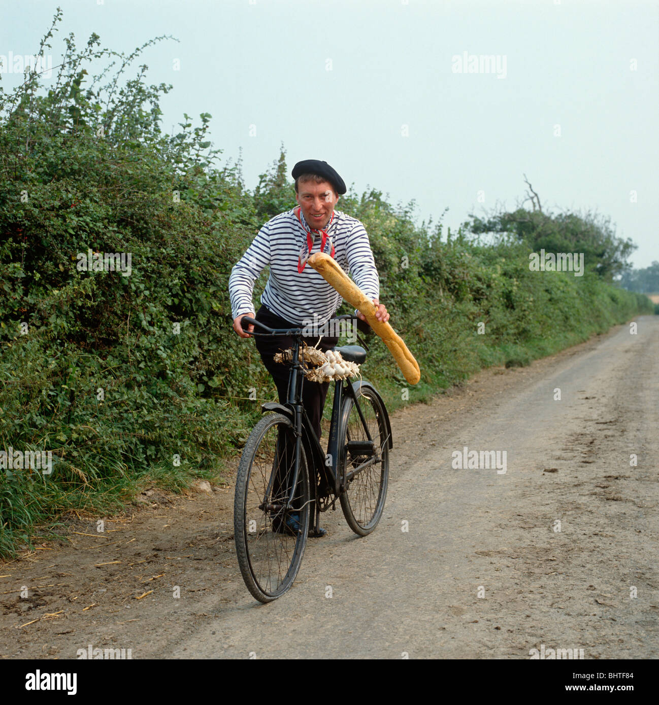 Image: http://c8.alamy.com/comp/BHTF84/man-on-old-bike-dressed-as-a-stage-french-onion-seller-BHTF84.jpg