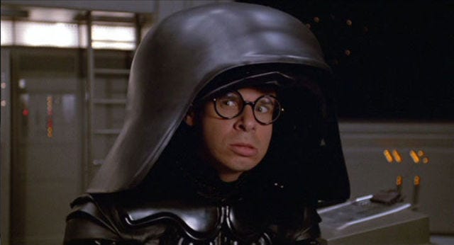Image: https://hips.hearstapps.com/pop.h-cdn.co/assets/17/23/640x346/gallery-1497019504-dark-helmet-unmasked.jpg?resize=1200:*